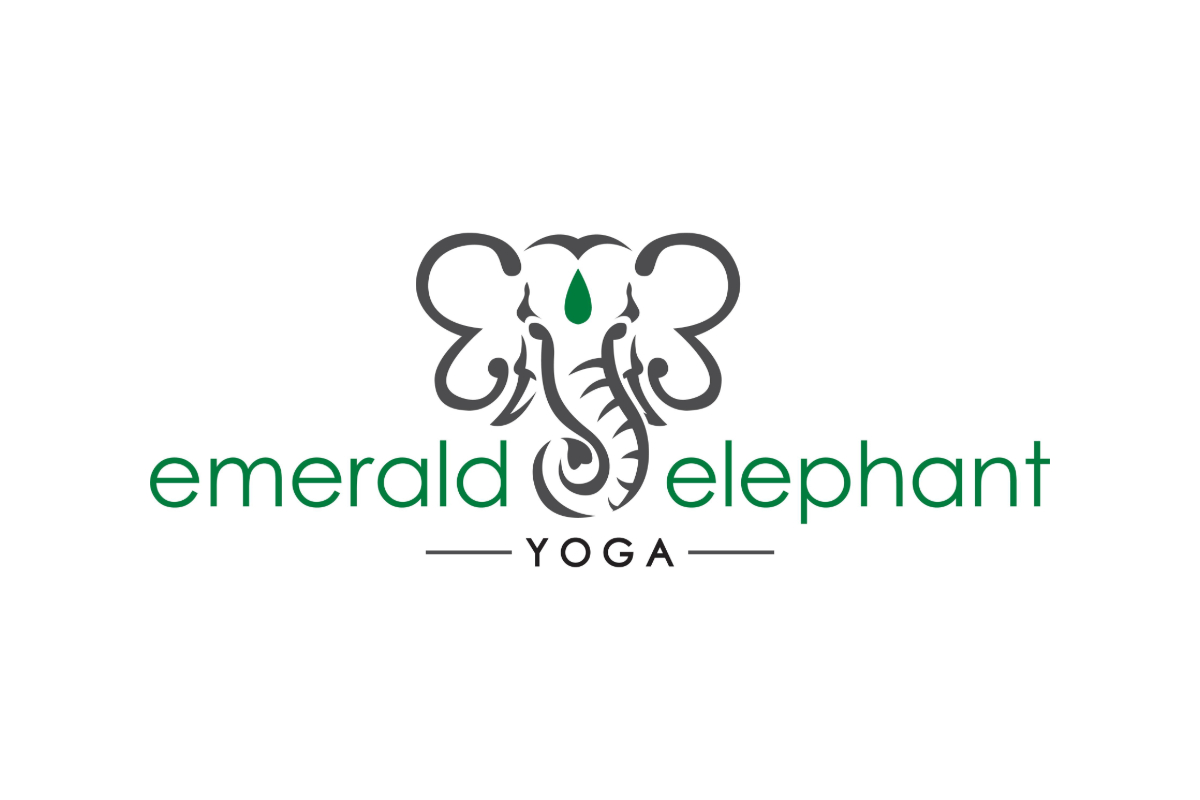 Minimalist elephant head outline logo with a green teardrop on the forehead, featuring "Emerald Elephant Yoga" in green and black lettering below the image.