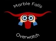 Logo with a red longhorn head. In front of the head, two hands hold binoculars. The words “Marble Falls” curve above and “Overwatch” curve below the image.