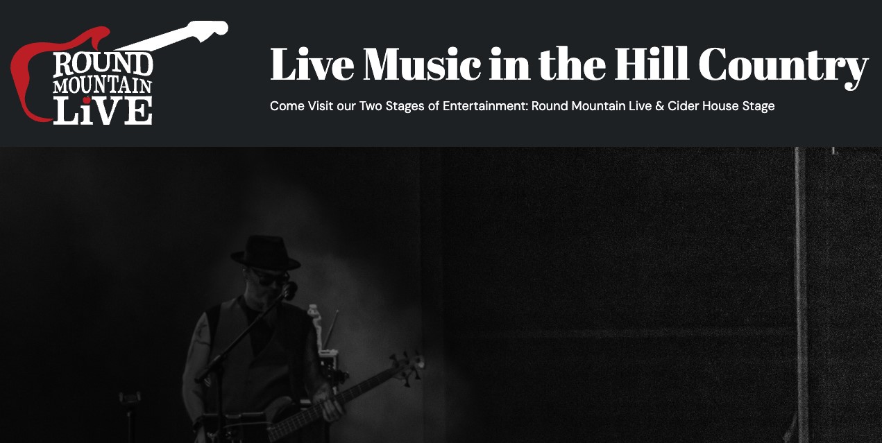 A promotional banner for Round Mountain Live features a red guitar logo and text reading Live Music in the Hill Country. Below, a musician in a hat plays guitar on a dimly lit stage.