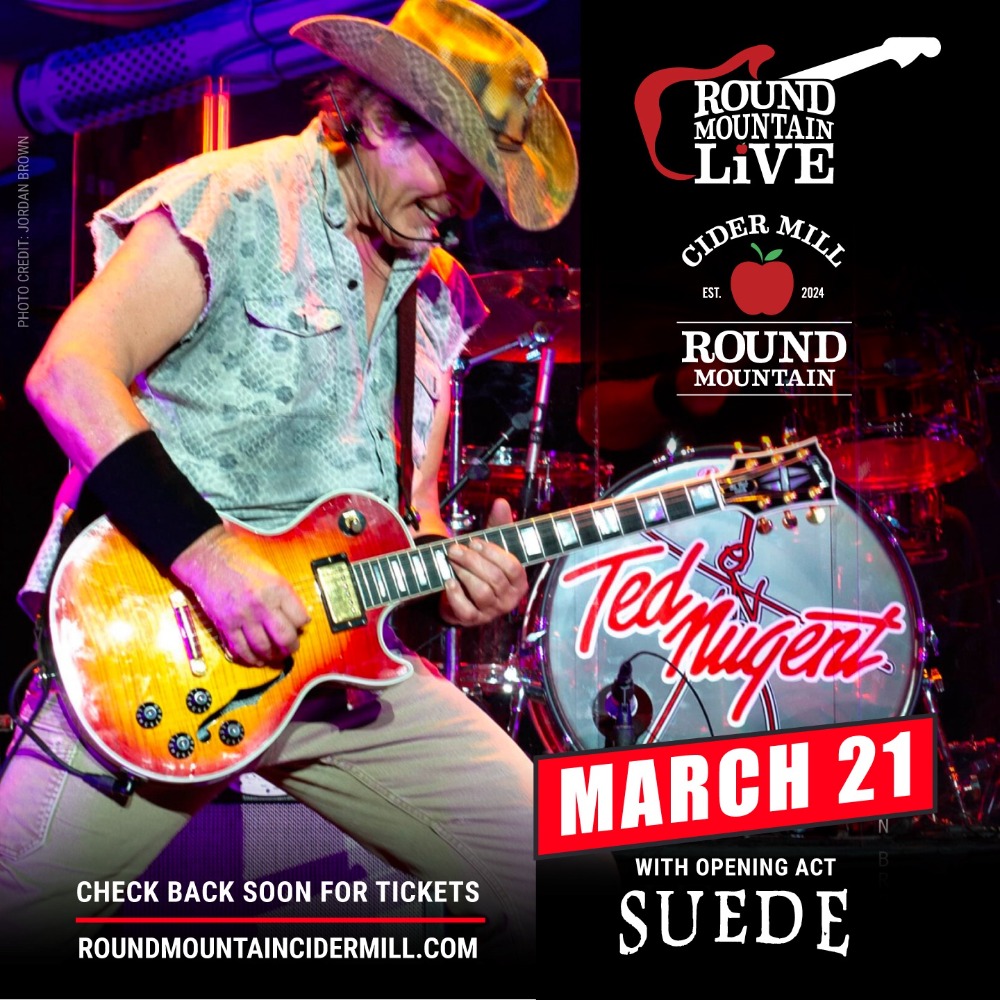 A man in a cowboy hat plays an electric guitar on stage. Text reads: Round Mountain Live at Cider Mill, Ted Nugent, March 21, with opening act Suede. Check back soon for tickets. roundmountaincidermill.com.