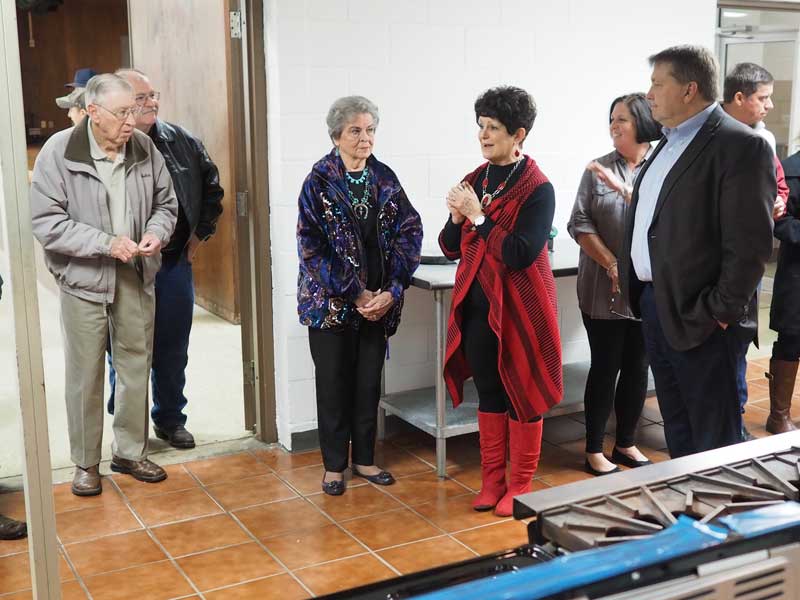 Burnet County Extension Agent Linda Wells (center) along with Burnet County Judge James Oakley (right) share how the new Texas A&M AgriLife Extension Service building, which includes a full, commercial kitchen, will benefit the entire community. Burnet County is leasing a portion of the old Burnet Elementary School to use as the Burnet County AgriLife Extension Office. Photo by Daniel Clifton