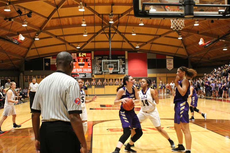 Marble Falls High School junior forward Aubree Adams protects the ball as junior center Mya McMillian prepares to offer a screen. Staff photo by Jennifer Fierro